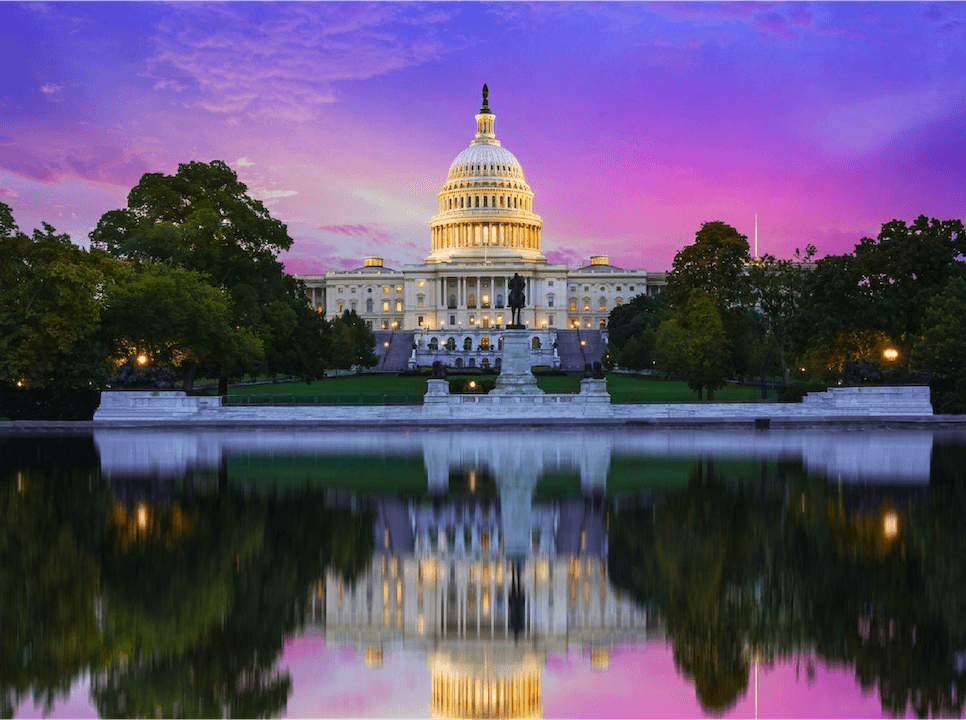 The U.S. capitol building reflected at sunset